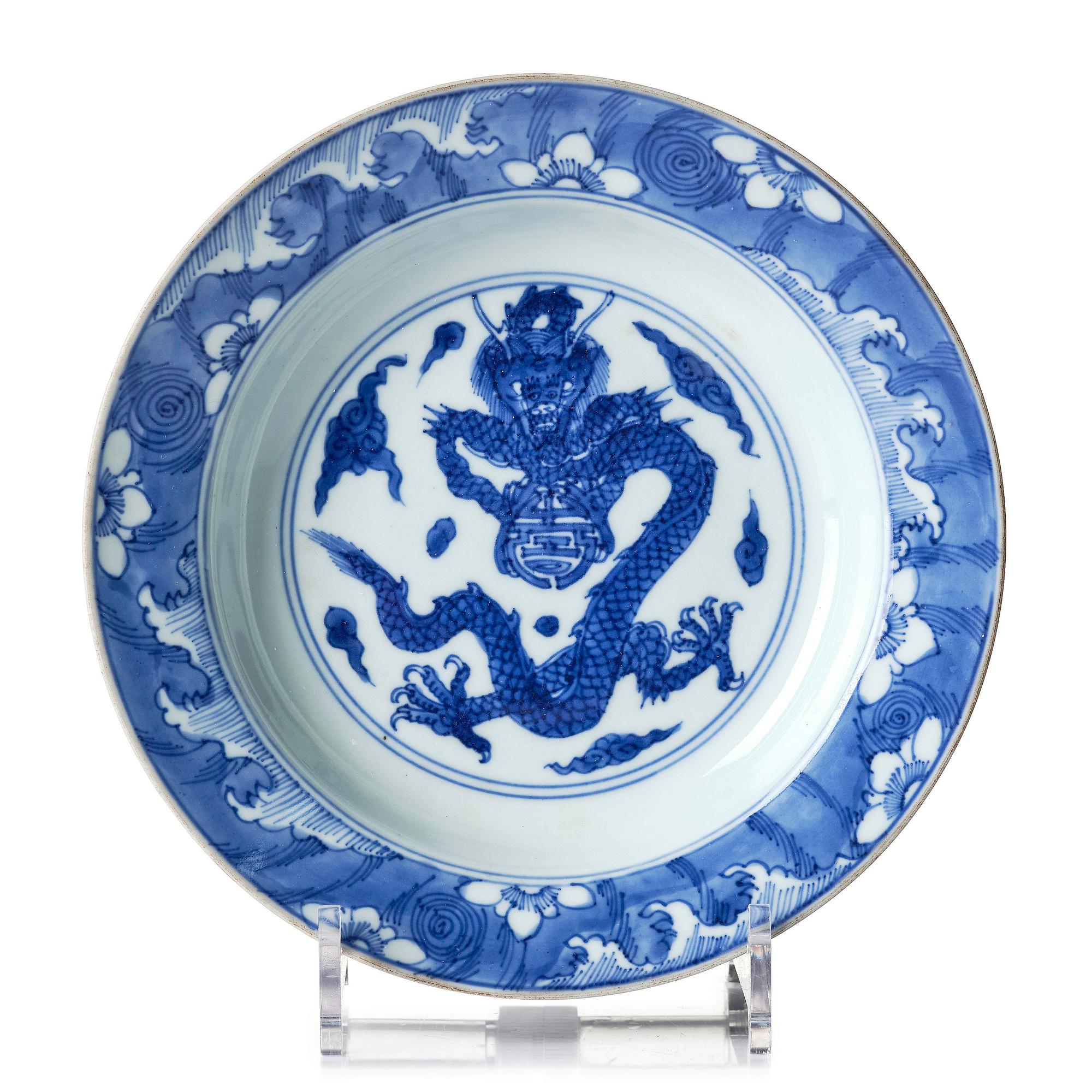 A blue and white 'dragon' dish, Qing dynasty with Yongzheng mark and of the period (1723-35).