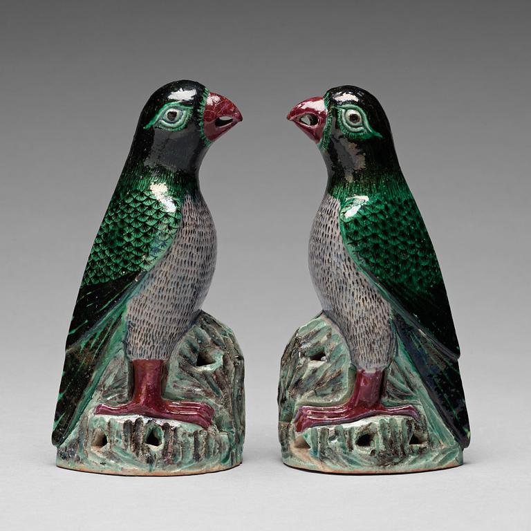 A pair of Chinese figures of parrots, late Qing dynasty.