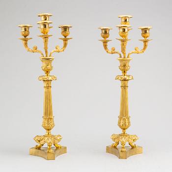 A pair of French Empire style four-light candelabra, second half of the 19th century.