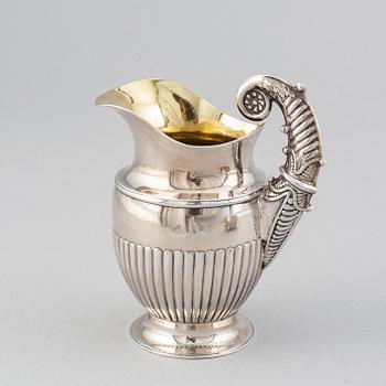 A silver creamer by Johan Petter Ahlforss, Strängnäs, 1833 and a silver sugar box, Kristianstad, 1928.
