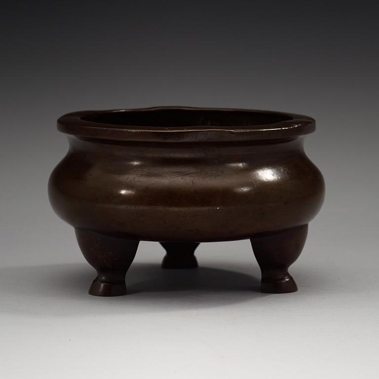 A bronze tripod censer, Ming dynasty (1368-1644).