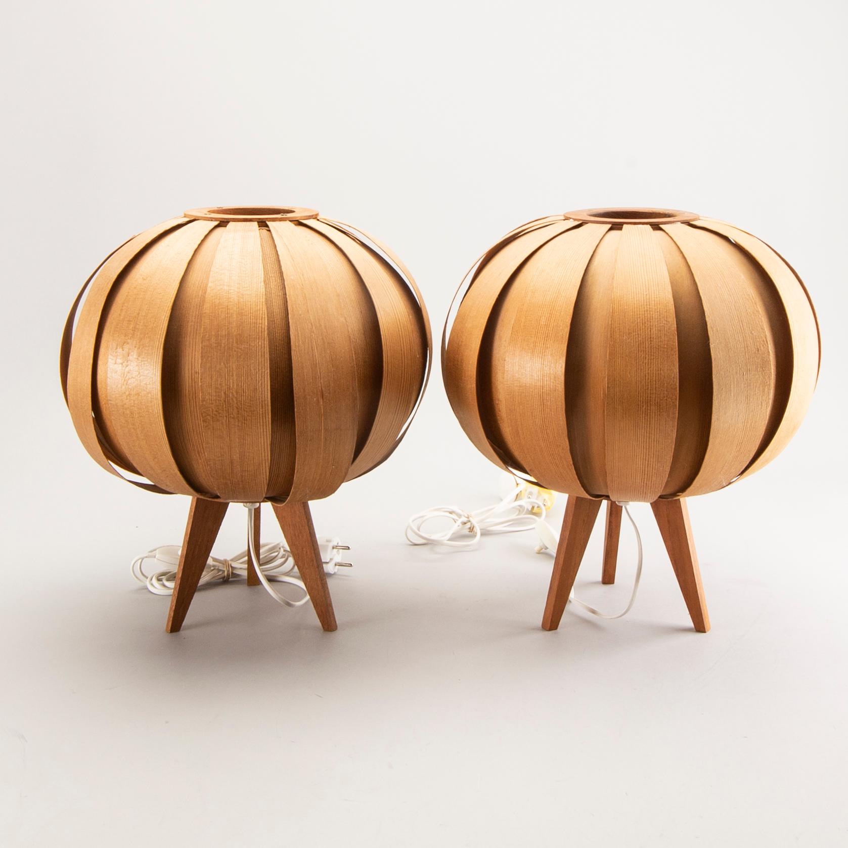 A pair of wooden table lamps.