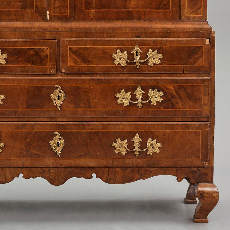 A rococo walnut parquetry cabinet, Stockholm, later part of the 18th century.