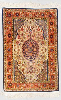 A rug, Old silk Hereke, ca 136 x 92 cm.