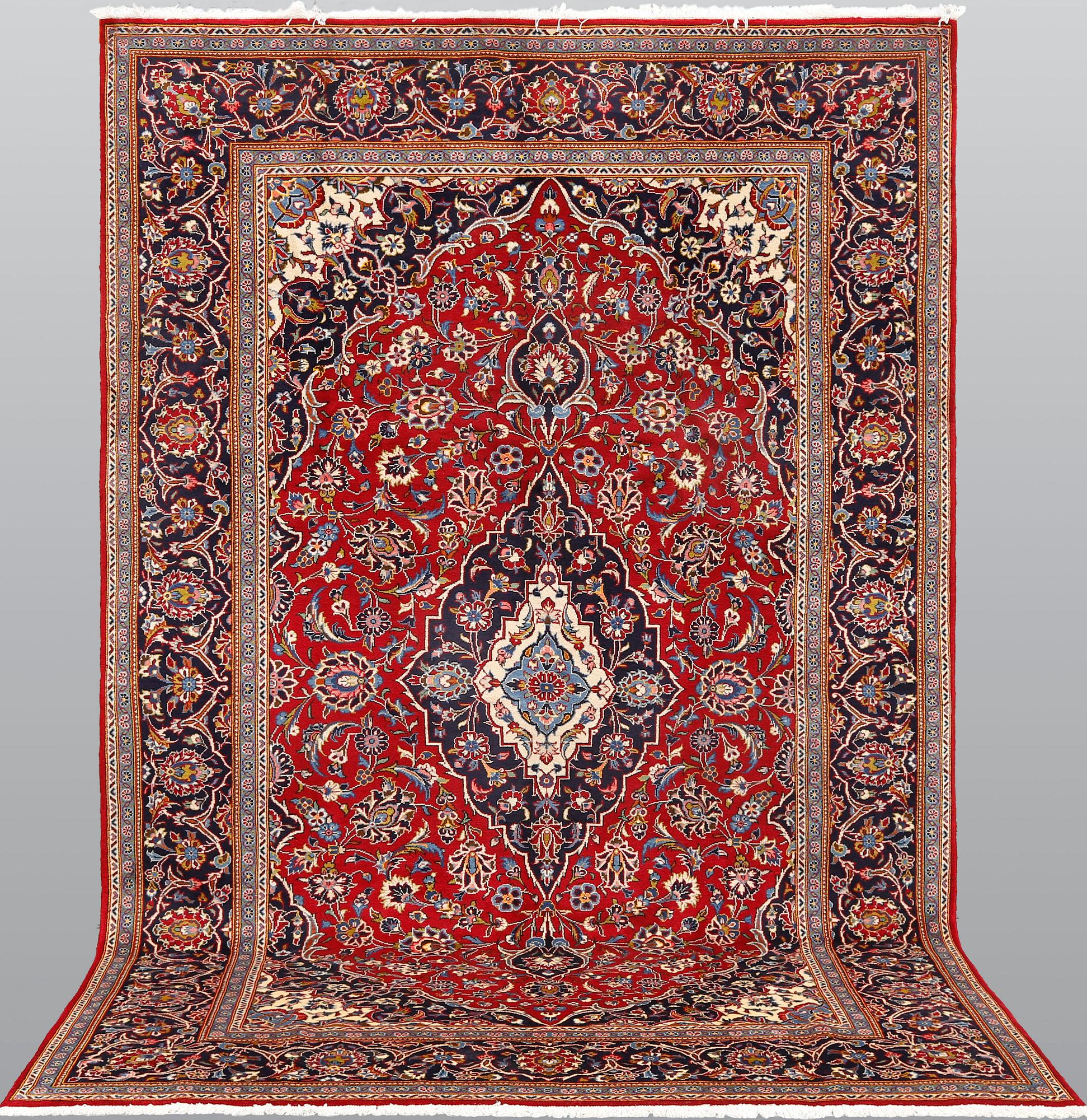A Kashan carpet, approximately 315 x 200 cm.
