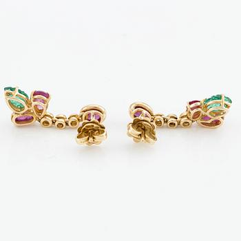 Earrings with cabochon-cut and faceted rubies, emeralds, and brilliant-cut diamonds.