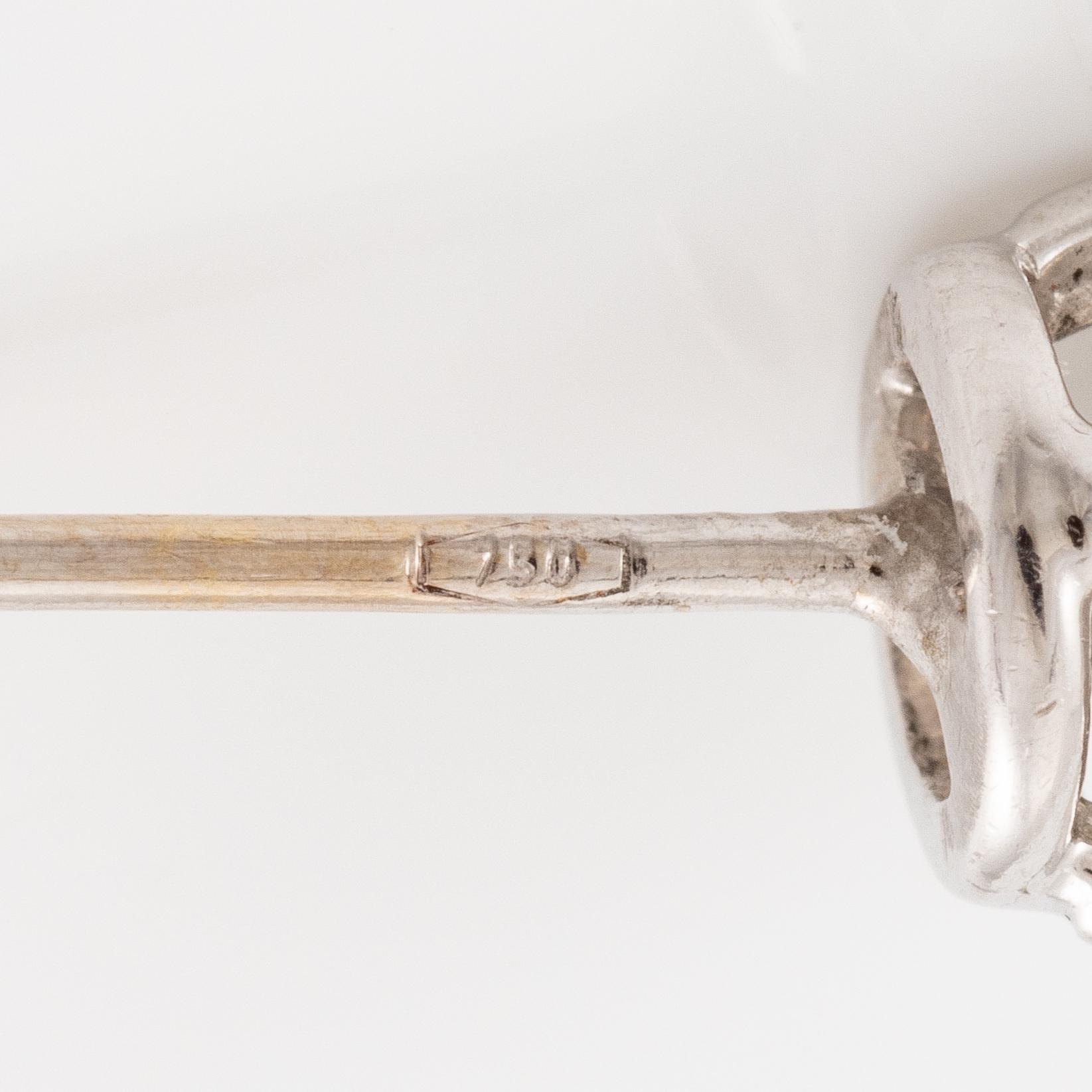 A pair of earrings in 18K white gold set with two round brilliant-cut diamonds, likely Tiffany & Co.