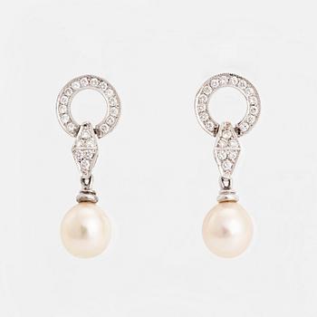 Pearl and brilliant cut diamond earrings.