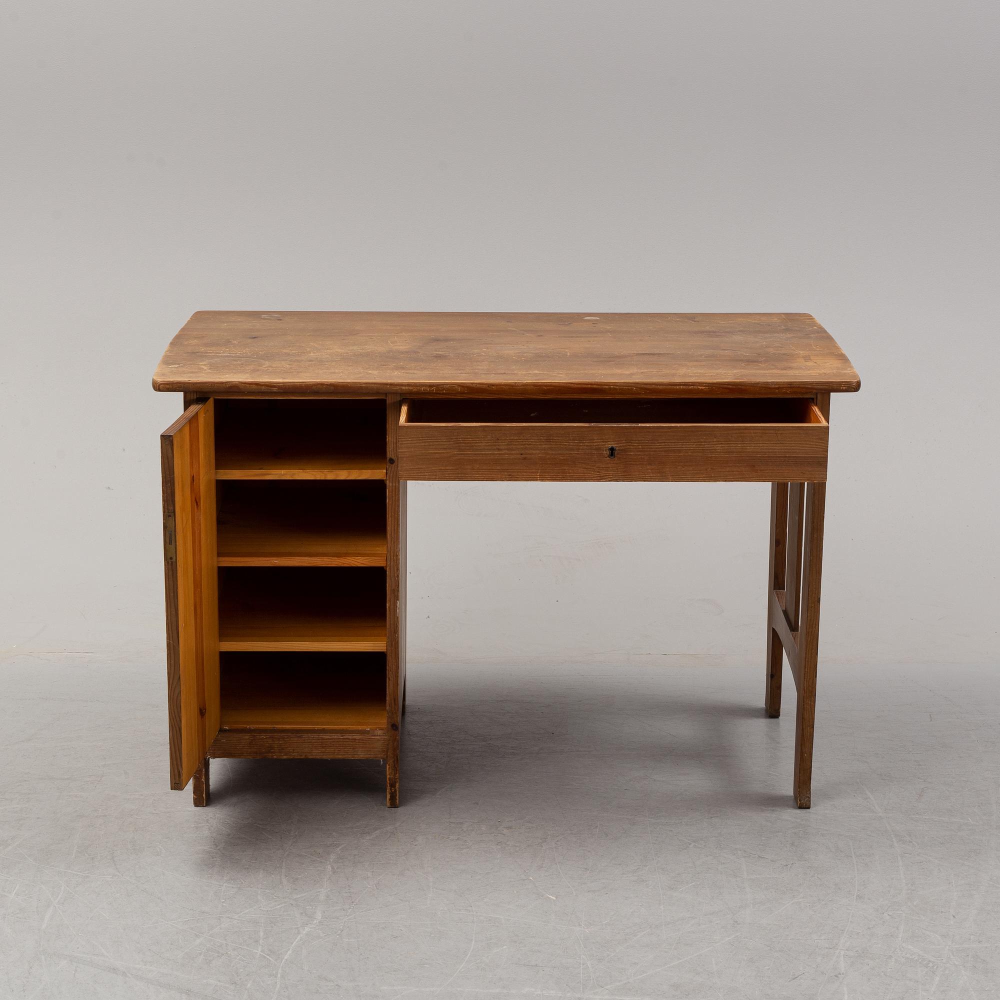 A stained pine writing desk attributed to Carl Westman, early 20th Century.