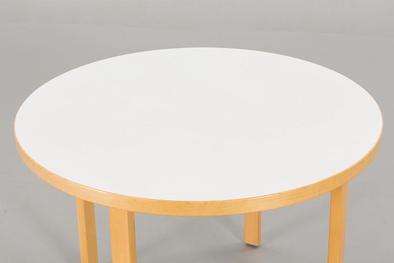 A TABLE AND FOUR CHAIRS DESIGNED BY ALVAR AALTO FOR ARTEK.