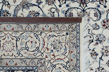 A Nain carpet, part silk, so called 6LAA, approximately 279 x 200 cm.