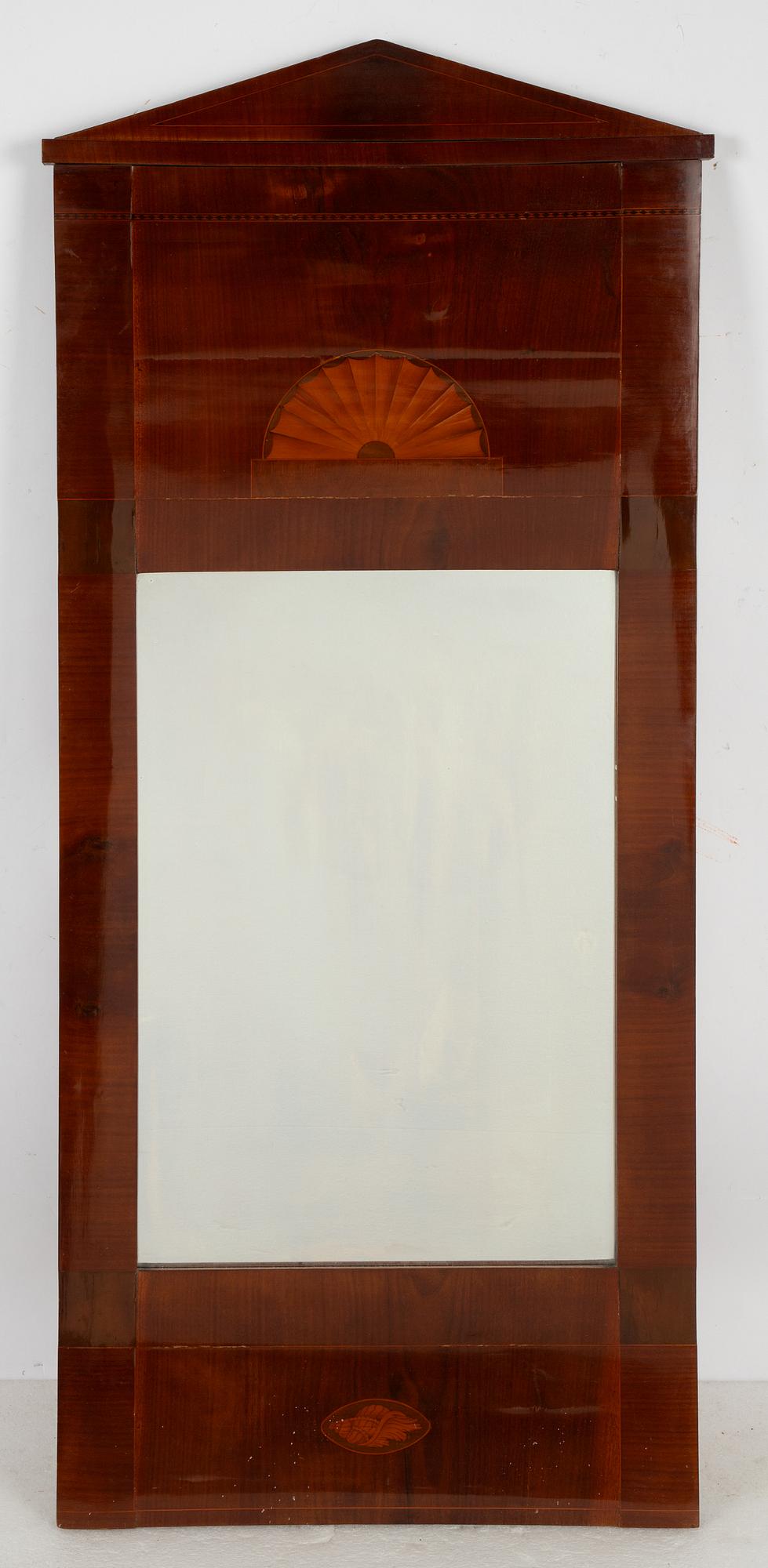 An Empire mirror, first half of the 19th Century.