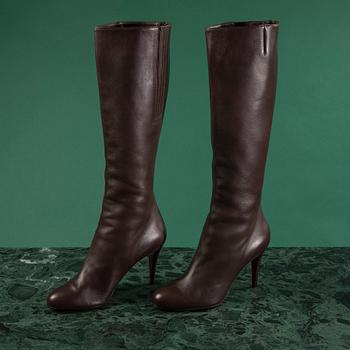 A pair of brown leather boots by Christian Louboutin, size 41 1/2.