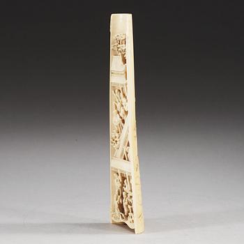 A carved ivory armrest, Qing dynasty.