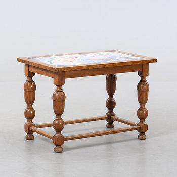 A SMALL TABLE DECORATED BY MARTIN POSER, dated 1944.
