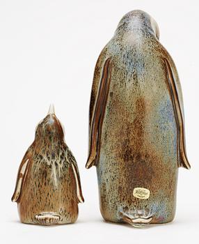 Two Gunnar Nylund stoneware figures depicting a penguin mother with child, Rörstrand.