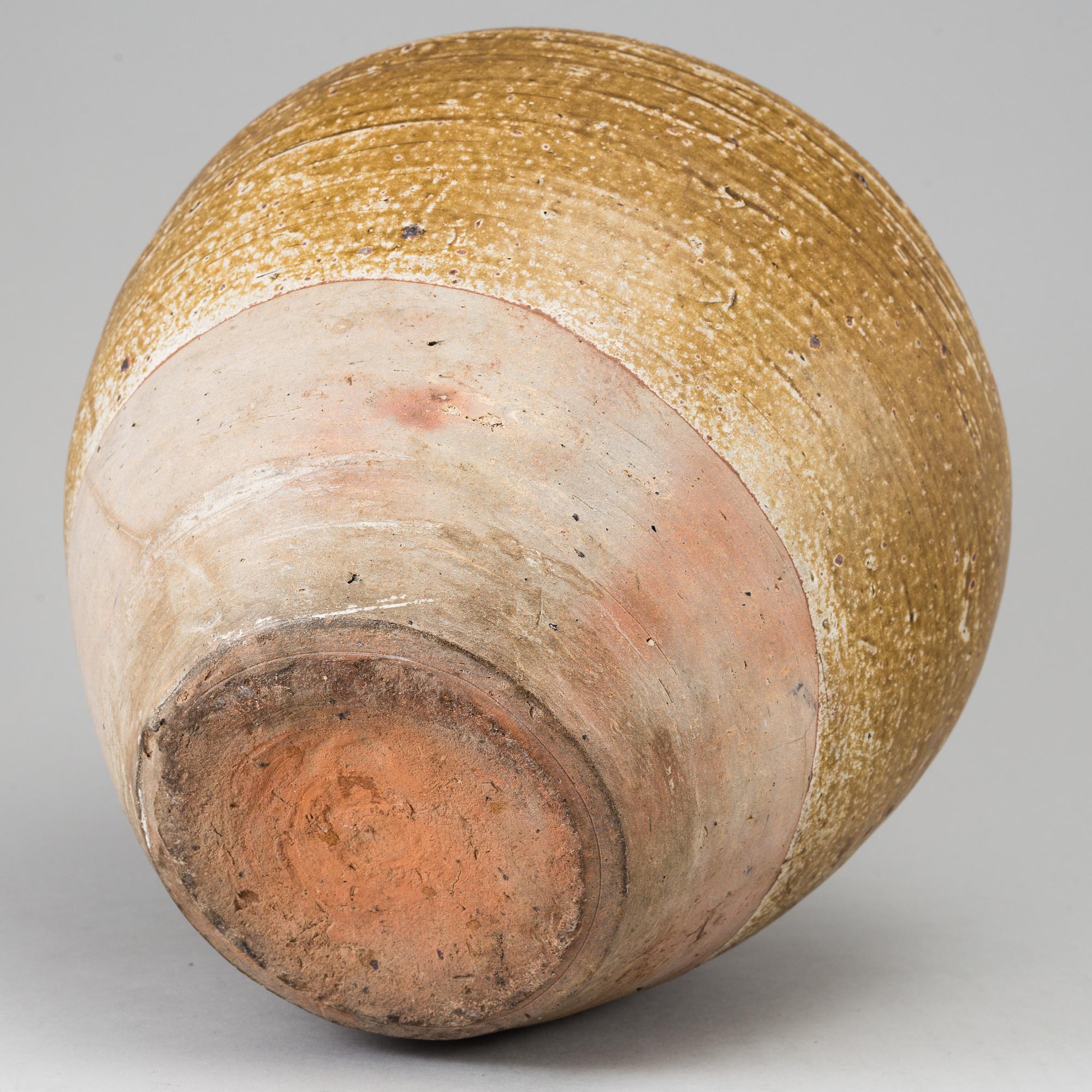 A olive green glazed jar, South East Asia, 18th Century or older.