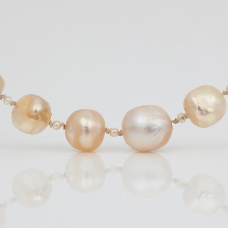 A possibly natural saltwater pearl necklace, clasp set with rose-cut diamonds.