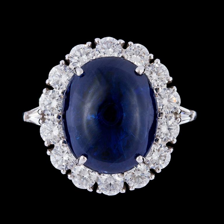 A cabochon cut blue Burmese sapphire, 10.57 cts, and brilliant cut diamond ring.