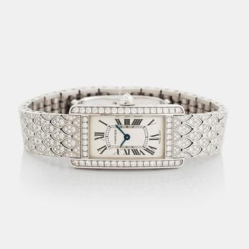 A Cartier "Tank Américane" 18K white gold watch set with round brilliant-cut diamonds.