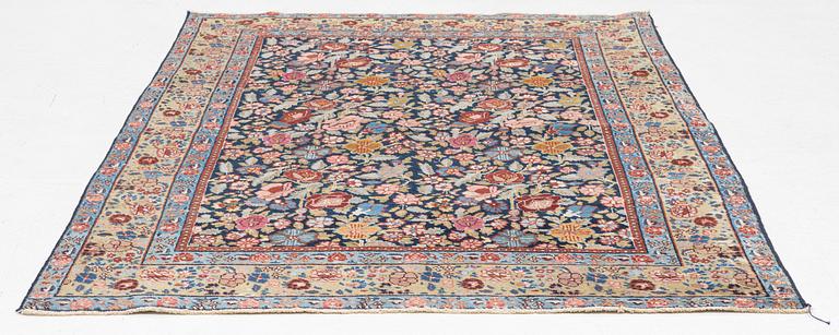 A rug, possibly Tabriz, c. 195 x 137 cm.