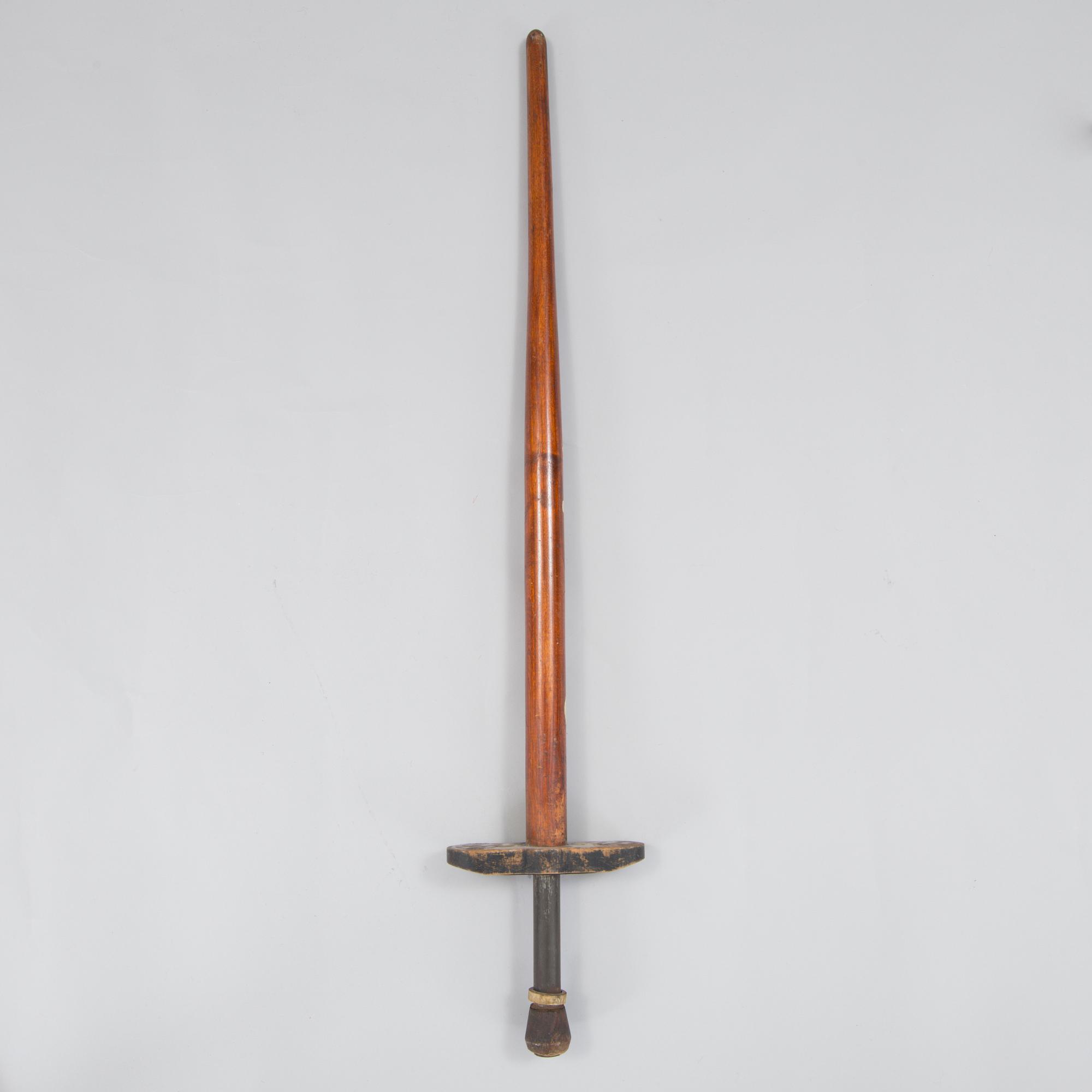 A 20th century wood pogo stick.