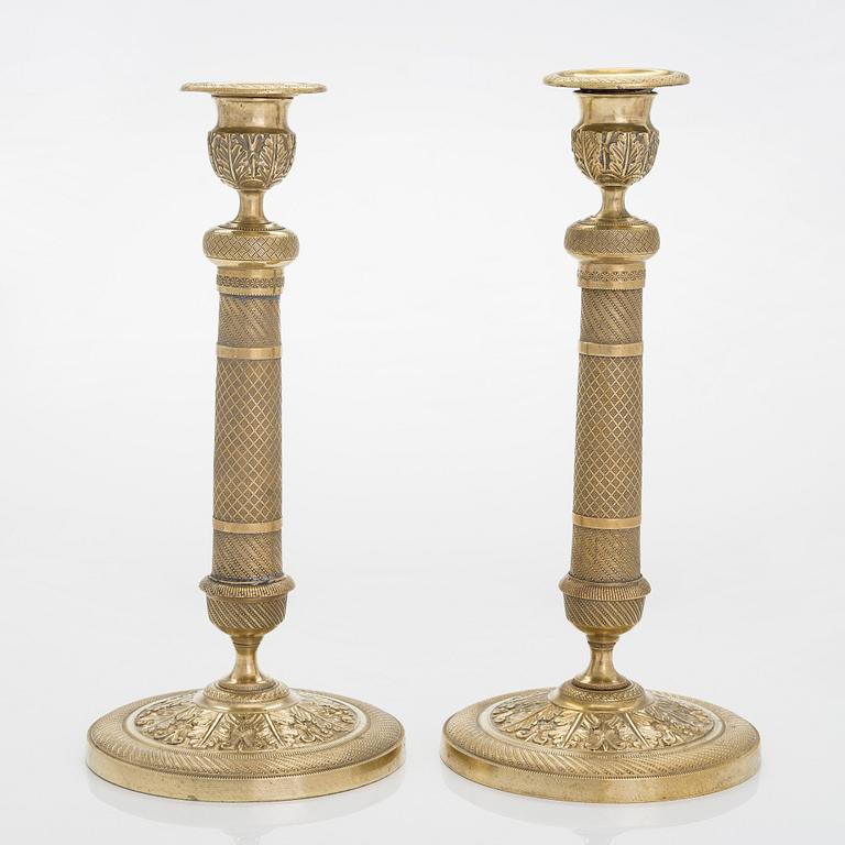 A pair of Empire style candlesticks, around 1900.