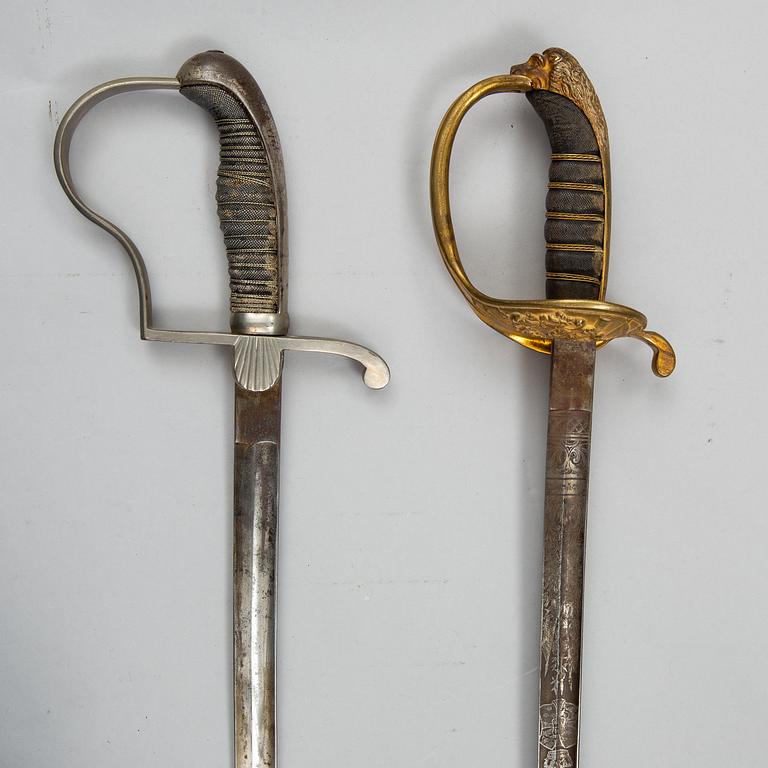 Two Swedish sabres, end of the 19th Century, with scabbards.