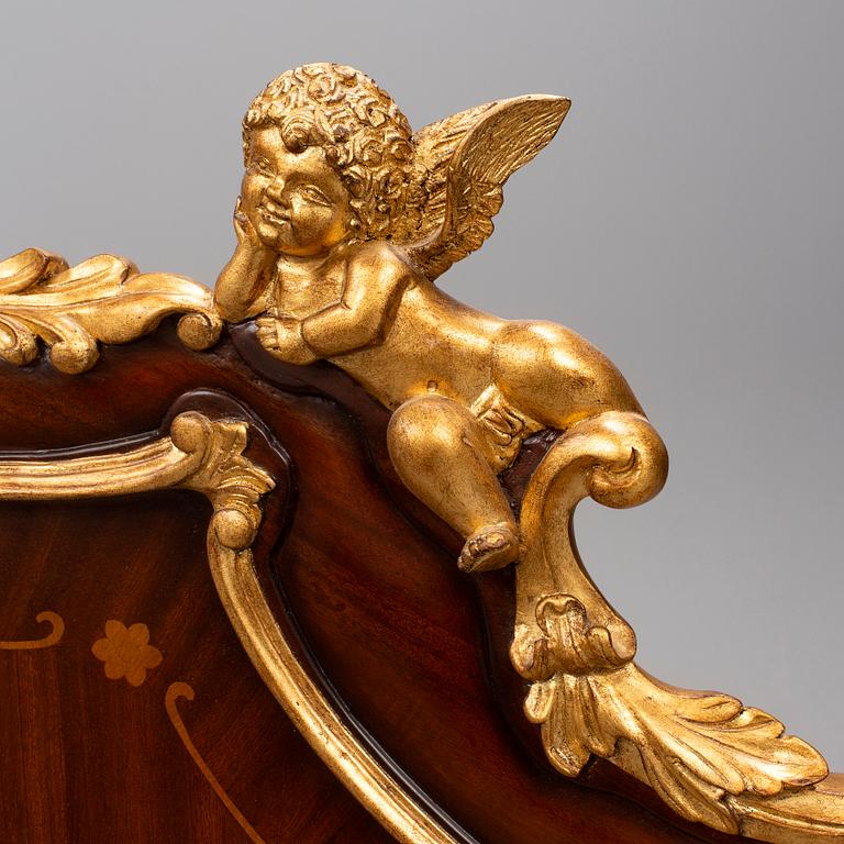 a set of a mahogany veneered and guilded rococo-style bed and two bedside tables.