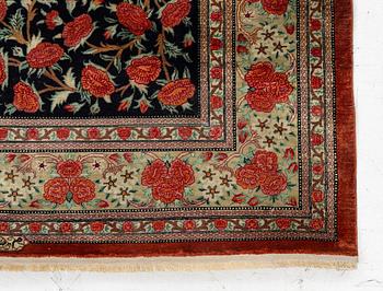 A signed silk Qum rug. c. 154 x 103 cm.