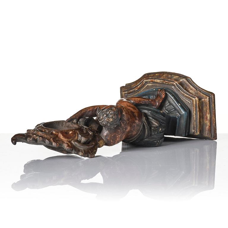 A Northern-European rococo carved pocket-watch holder, later part 18th century.