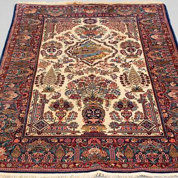 A RUG, a semi-antique Kashan part silk, ca 207,5 x 134,5 cm (as well as one end with 1,5 cm flat weave).