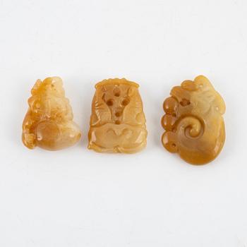 Three stone pendants, China, 20th century.