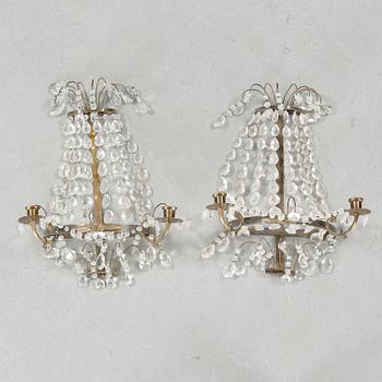 A pair of wall chandeliers from the first half of the 20th century.