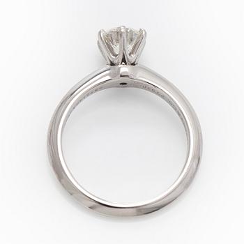 Tiffany & Co, a platinu solitaire ring with a brilliant-cut diamond.