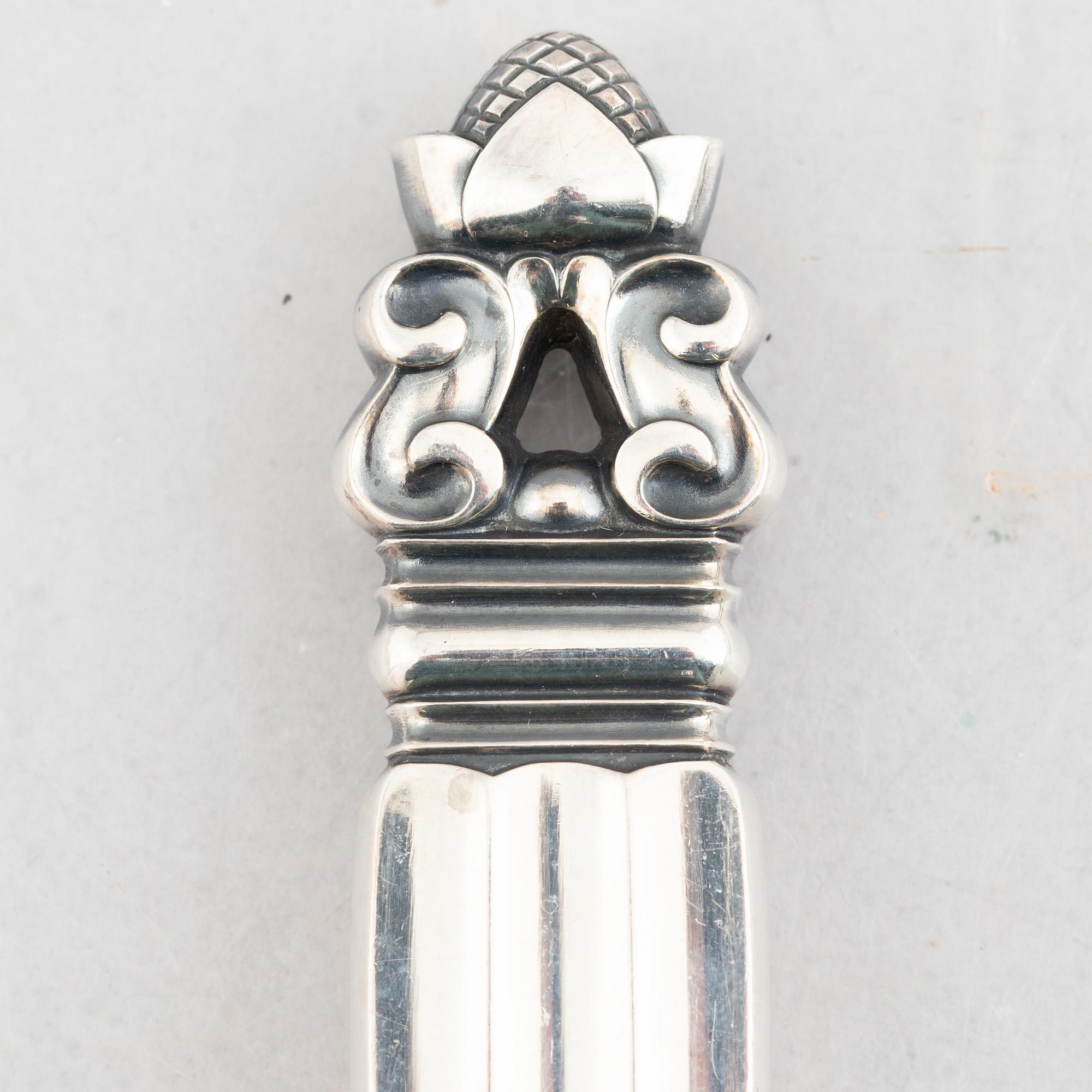 Johan Rohde, a 63-piece sterling silver flat wear set, "Konge"/"Acorn", Georg Jensen, Denmark.