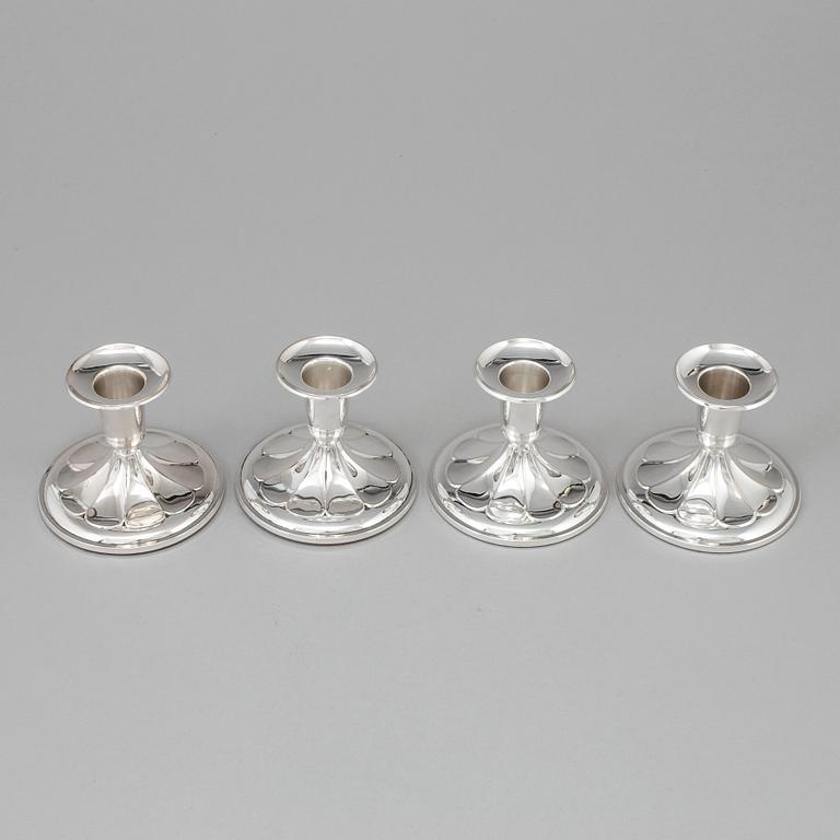 A set of four silver Candlesticks,