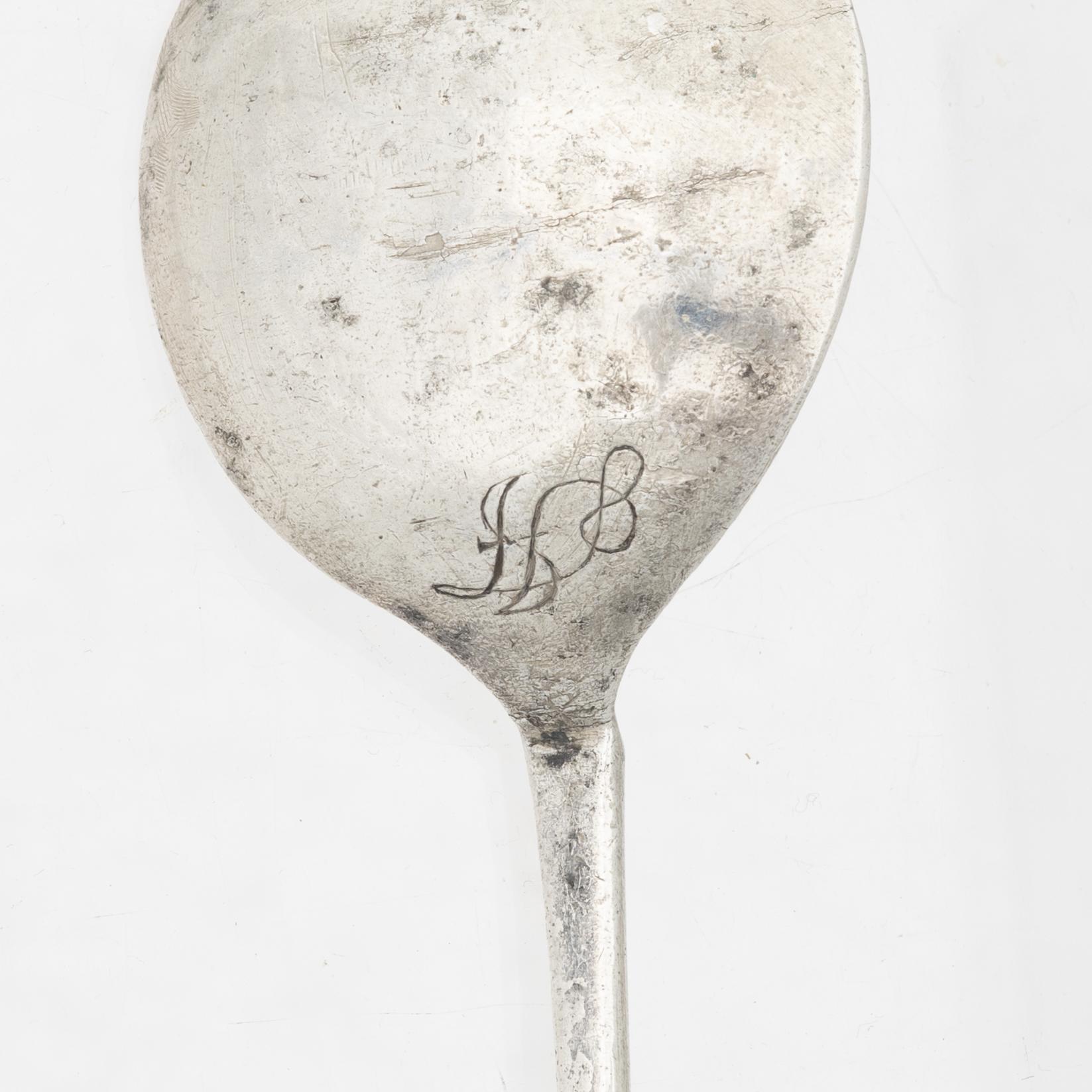 Two unmarked silver spoons, likely 18th century.