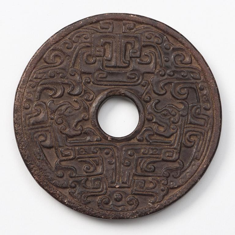 A group of three archaistic Chinese stone bi discs and two pendants.