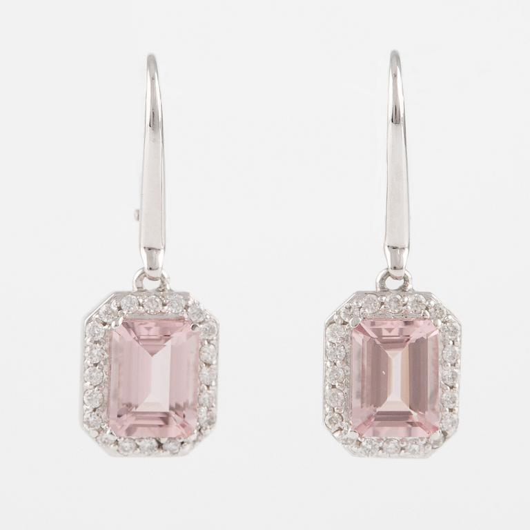 A pair of earrings with faceted morganite and round brilliant-cut diamonds.