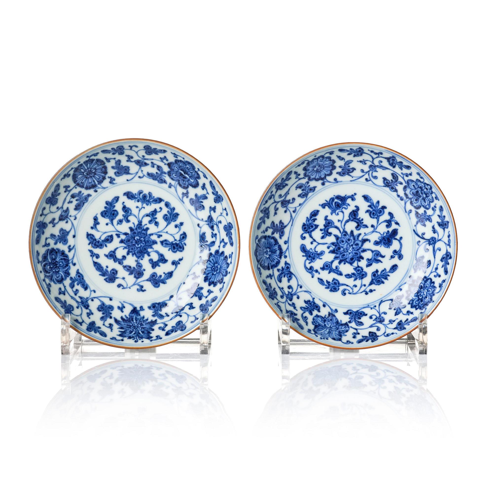 A pair of blue and white floral dishes, Qing dynasty, with Qianlong mark and of the period (1736-95).