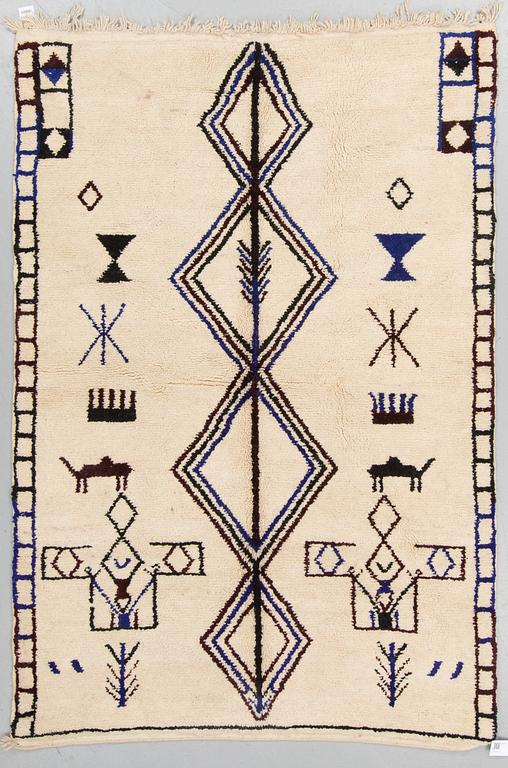 A rug from Morocco, around 227 x 158 cm.