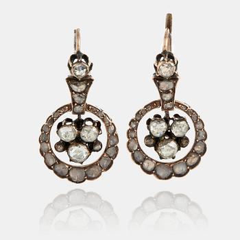 1131. A pair of earrings set with rose-cut diamonds.