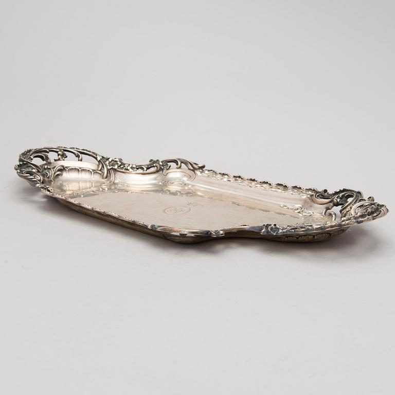 A German silver tray, mark of M.H. Wilkens & Söhne, Austrian import mark, retailer mark of V. Mayers Söhne, 1891-1901.