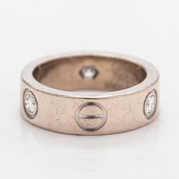 Cartier, an 18K white gold 'Love' ring with three brilliant-cut diamonds.