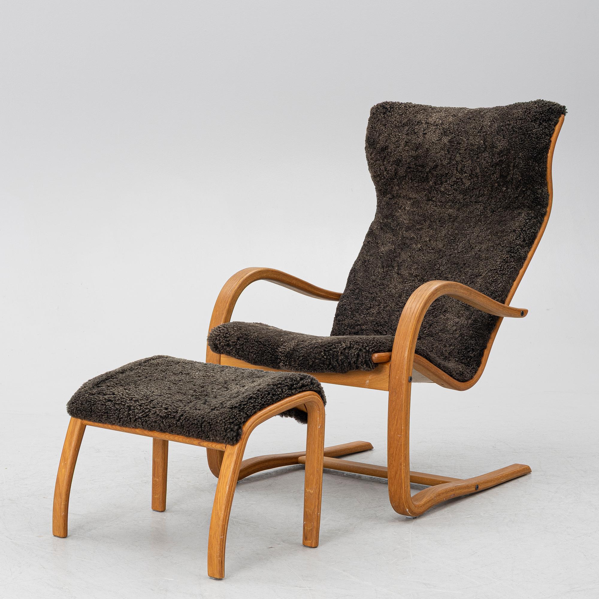 Jan Ekström, a "Gazell" armchair with a footstool, 21st century.
