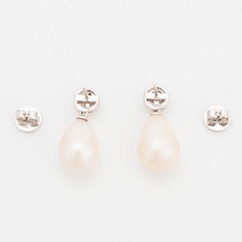 A pair of 18K white gold and cultured pearl earrings set with round brilliant-cut diamonds.