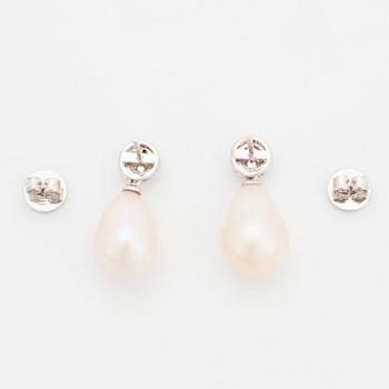 A pair of 18K white gold and cultured pearl earrings set with round brilliant-cut diamonds.