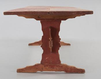 A Swedish 18/19th century red stained trestle table.