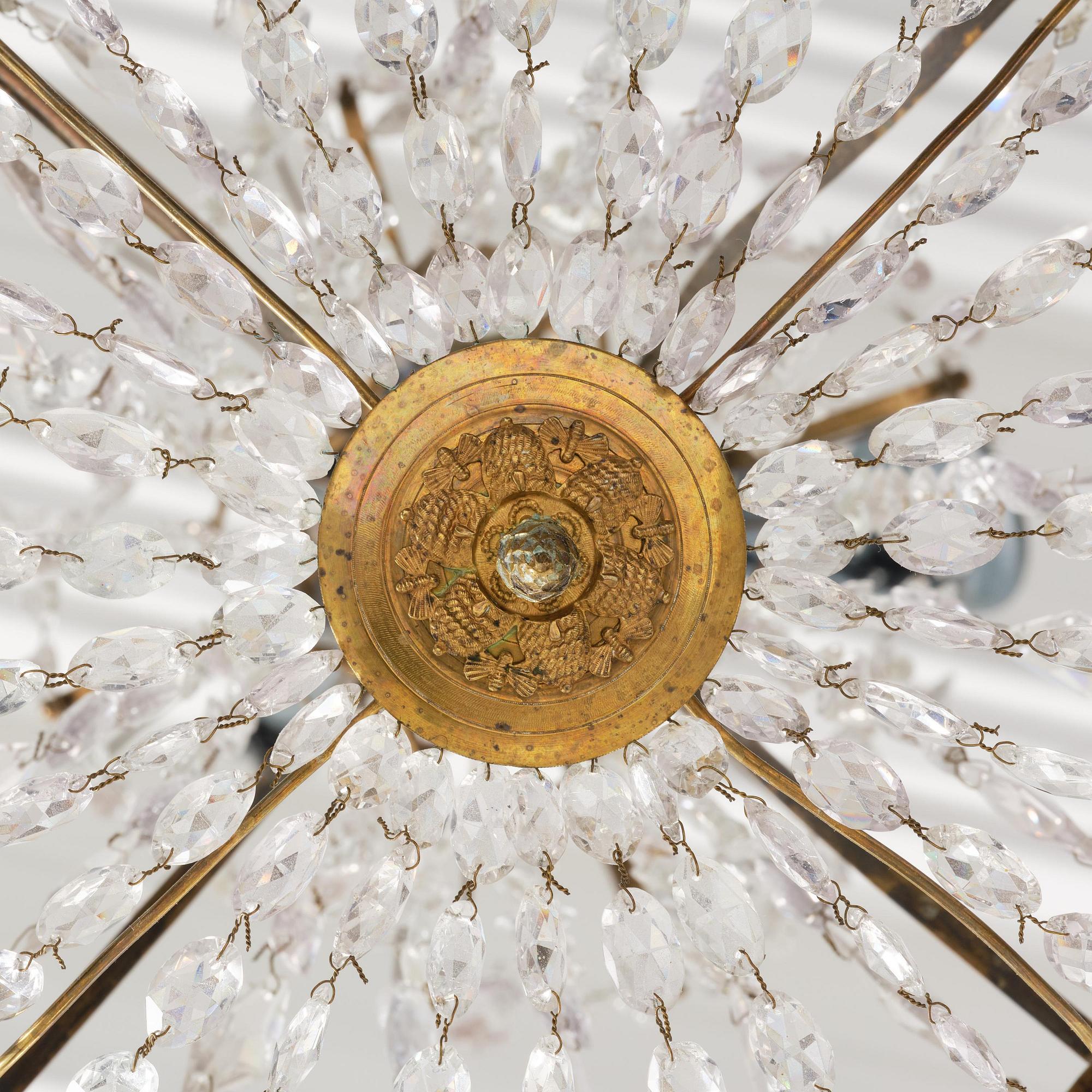 A late-Gustavian five-light gilt brass and cut glass chandelier, Stockholm, circa 1800.
